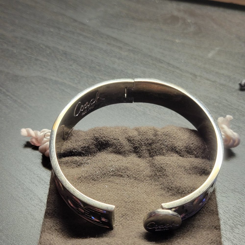Coach silver hinged braclet.